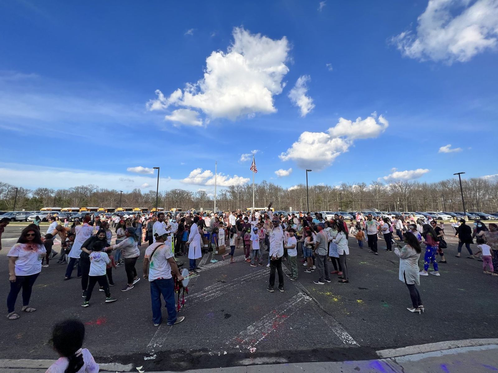 Crowd celebrating Holi at Robbinsville High School