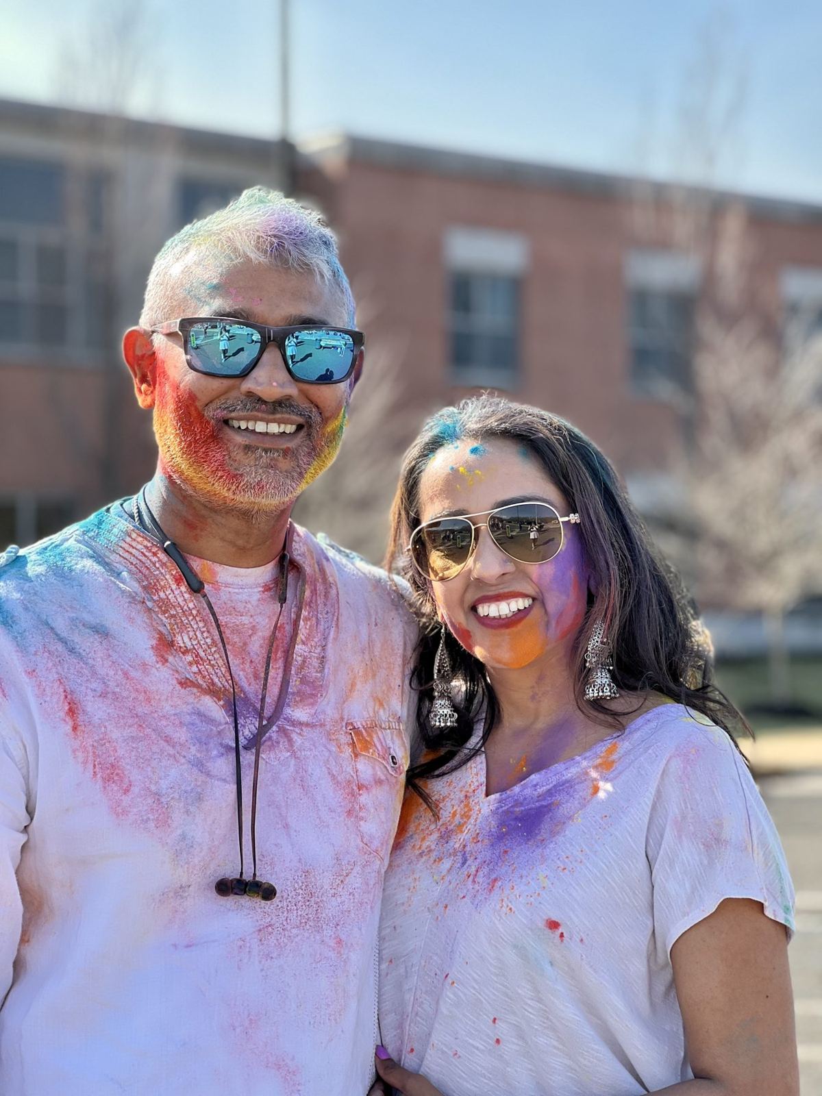 Jai and Somna Gulati covered in Holi colors