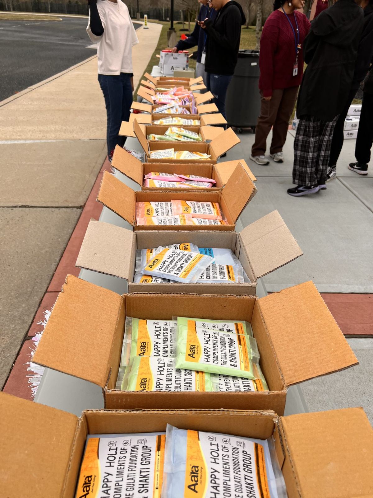 Boxes of Holi color packets from the Gulati Foundation