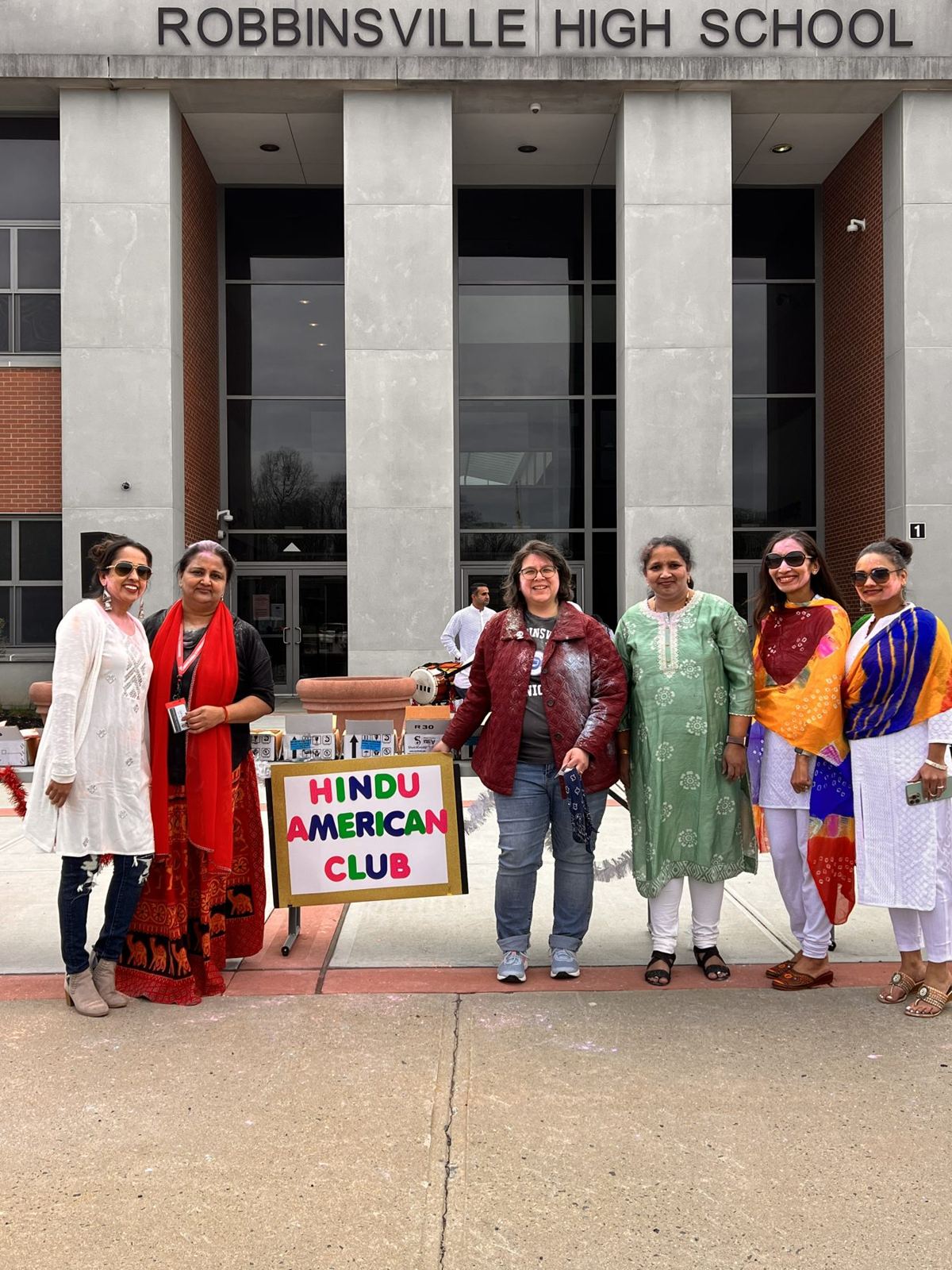Student volunteers at the school entrance