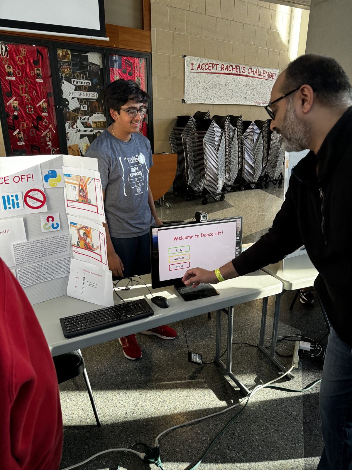 A guest tries a student-built dance game