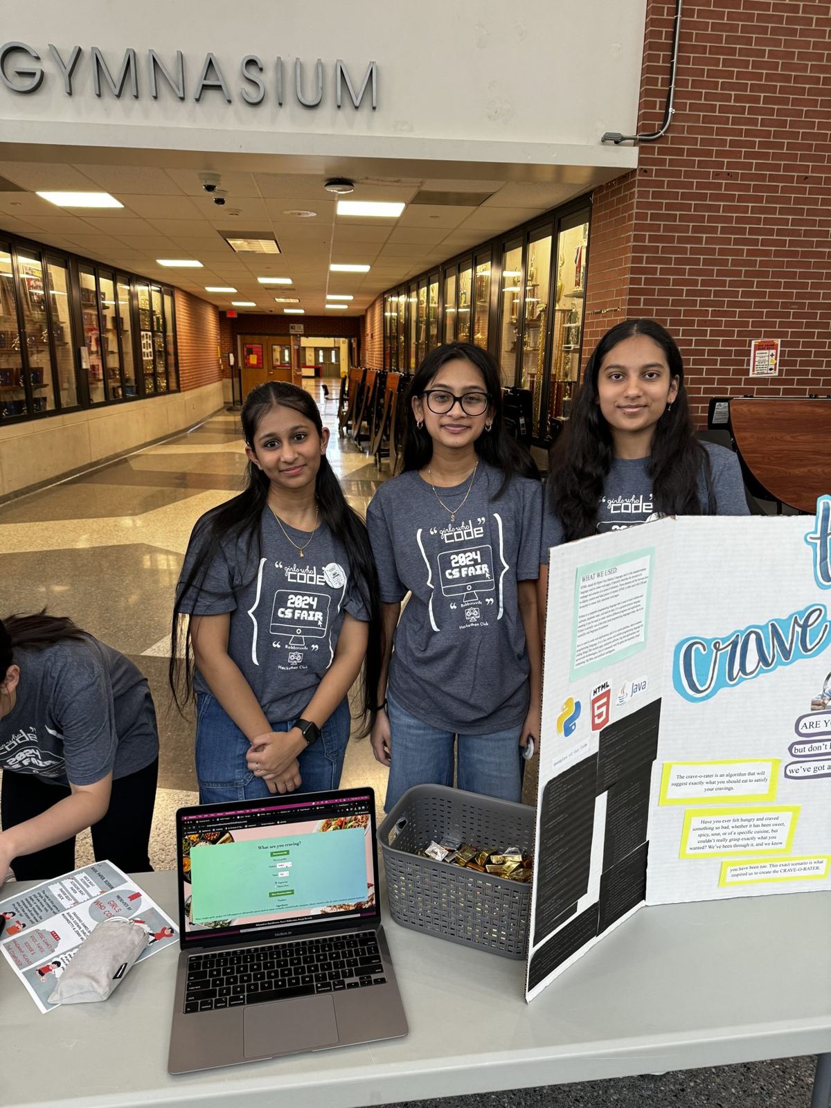 Three Girls Who Code members with their project