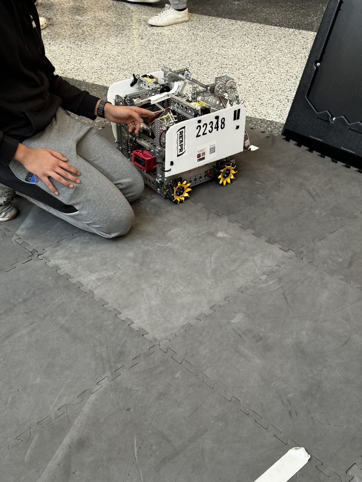 A student with the team’s competition robot