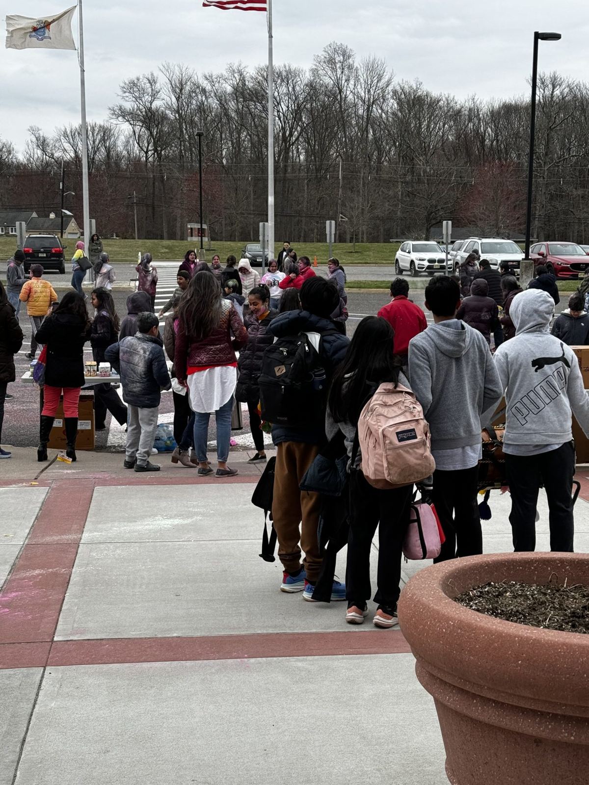 Wide view of the Holi celebration in the school lot