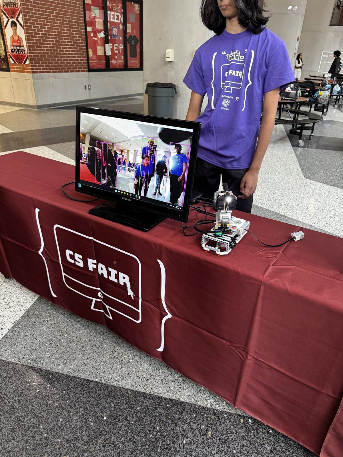 A student-built robot demo at the CS Fair table