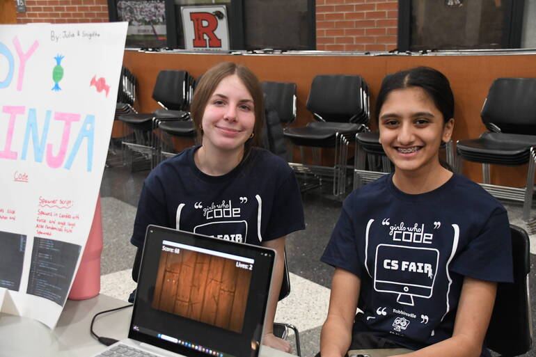 Two Girls Who Code members with their Candy Ninja game